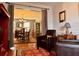 Comfortable living room with hardwood floors, a glimpse of the dining room, and comfortable armchairs at 7 Lavington Rd, Charleston, SC 29407