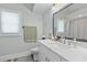 Fresh bathroom featuring a decorative mirror, vanity, and new toilet at 7 Wesley Dr, Charleston, SC 29407