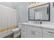 Bathroom featuring modern vanity, marble countertop, and decorative mirror at 7 Wesley Dr, Charleston, SC 29407