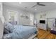 This bedroom boasts an abundance of natural light and hardwood floors at 7 Wesley Dr, Charleston, SC 29407