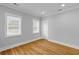 Cozy bedroom with hardwood floors, natural light, and white trim at 7 Wesley Dr, Charleston, SC 29407