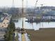 Bridge construction site with cranes and equipment, near the waterfront at 7 Wesley Dr, Charleston, SC 29407