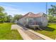 This home features a brand new red roof, grey paint and a well manicured lawn at 7 Wesley Dr, Charleston, SC 29407