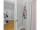 Hallway featuring newly refinished hardwood floors, closet, and bathroom at 7 Wesley Dr, Charleston, SC 29407