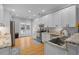 Kitchen showcasing white cabinetry, hardwood floors, and stainless steel appliances at 7 Wesley Dr, Charleston, SC 29407