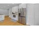 Bright kitchen featuring white cabinets, stainless steel appliances, and hardwood floors at 7 Wesley Dr, Charleston, SC 29407