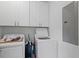 Functional laundry room with ample storage, white cabinets, and modern appliances at 7 Wesley Dr, Charleston, SC 29407