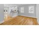 Open living area with hardwood floors and bar seating leading into kitchen, perfect for entertaining and everyday living at 7 Wesley Dr, Charleston, SC 29407