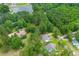 Overhead view of homes surrounded by lush green trees showcases properties location and proximity to the lake at 727 Hodge Rd, Summerville, SC 29483