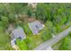 Aerial view of a residential area featuring a white home, tree coverage and long driveway at 727 Hodge Rd, Summerville, SC 29483