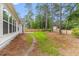 Large backyard with privacy fence, mature trees, and a patio perfect for outdoor entertaining and relaxing at 727 Hodge Rd, Summerville, SC 29483
