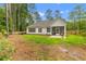 Beautiful backyard with a well-maintained lawn and a screened patio, perfect for outdoor relaxation and entertaining at 727 Hodge Rd, Summerville, SC 29483