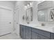 Bathroom with double vanity, modern mirrors and fixtures, and door to water closet at 727 Hodge Rd, Summerville, SC 29483