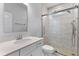 Modern bathroom features a glass-enclosed shower, marble tiling, updated vanity and fixtures with natural light at 727 Hodge Rd, Summerville, SC 29483