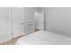 Bright bedroom features modern doors, shelving and neutral decor with an open doorway leading to another room at 727 Hodge Rd, Summerville, SC 29483