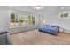 Bright bedroom with large windows offering views of fenced in backyard at 727 Hodge Rd, Summerville, SC 29483