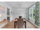 Elegant dining room featuring modern chandelier, large windows with natural light, and stylish chairs at 727 Hodge Rd, Summerville, SC 29483