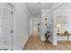Bright hallway with hardwood floors, white trim and doors and neutral paint palette at 727 Hodge Rd, Summerville, SC 29483