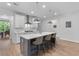 Kitchen island with gray cabinets, white countertops, stainless steel fixtures, and seating at 727 Hodge Rd, Summerville, SC 29483