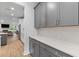 Gray kitchen cabinets with white countertops and subway tile backsplash in an open concept design at 727 Hodge Rd, Summerville, SC 29483