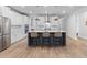 Kitchen island with gray cabinets, white countertops, stainless steel fixtures, and seating at 727 Hodge Rd, Summerville, SC 29483
