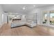 Bright living room with L-shaped couch, open floor plan, and access to outdoor patio at 727 Hodge Rd, Summerville, SC 29483