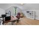 Bright home office with hardwood floors, features a modern desk setup, comfortable seating, and ample natural light at 727 Hodge Rd, Summerville, SC 29483