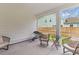 Relaxing screened patio with comfortable seating, perfect for outdoor entertaining with a view of the backyard at 727 Hodge Rd, Summerville, SC 29483