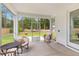Inviting screened patio featuring comfortable seating and an outdoor grill, perfect for relaxing and entertaining at 727 Hodge Rd, Summerville, SC 29483