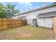 This home features a fenced backyard with grass at 7813 Sandida Ct, North Charleston, SC 29418