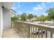 Balcony with railings overlooking the street at 7813 Sandida Ct, North Charleston, SC 29418