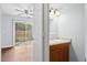 Half bathroom with a wooden vanity featuring a sink and mirror at 7813 Sandida Ct, North Charleston, SC 29418