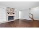 Spacious living room features a stone fireplace with built-in shelves and wood flooring at 7813 Sandida Ct, North Charleston, SC 29418