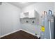 Utility room with water heater and cabinets at 7813 Sandida Ct, North Charleston, SC 29418