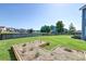 Large backyard with a lake view and a garden at 8038 Regency Elm Dr, North Charleston, SC 29406