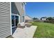 Patio area with outdoor seating, perfect for relaxing and enjoying the backyard view at 8038 Regency Elm Dr, North Charleston, SC 29406