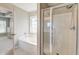 Bright en suite bathroom featuring a bathtub, walk-in shower with a window for natural lighting at 8038 Regency Elm Dr, North Charleston, SC 29406