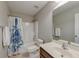 Bright bathroom featuring a shower-tub combo with a fun, patterned shower curtain and a single sink vanity at 8038 Regency Elm Dr, North Charleston, SC 29406