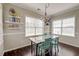 Inviting dining room with abundant natural light and unique decor accents at 8038 Regency Elm Dr, North Charleston, SC 29406
