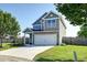 Charming two-story home with a well-manicured lawn, a two-car garage, and inviting curb appeal at 8038 Regency Elm Dr, North Charleston, SC 29406