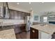 Well-appointed kitchen with stainless steel appliances, granite countertops, and dark wood cabinetry at 8038 Regency Elm Dr, North Charleston, SC 29406