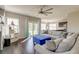 Open-concept living room with fireplace and an oversized sectional sofa that connects to kitchen at 8038 Regency Elm Dr, North Charleston, SC 29406