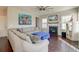 Comfortable living room featuring a fireplace, ceiling fan, and hardwood floors at 8038 Regency Elm Dr, North Charleston, SC 29406