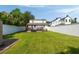 Backyard view featuring a green lawn, white fence, and a deck at 814 Rutledge Ave, Charleston, SC 29403
