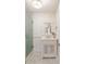 Chic bathroom with patterned wallpaper, modern vanity, and glass-enclosed shower at 814 Rutledge Ave, Charleston, SC 29403