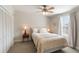 Cozy bedroom with ceiling fan, natural light, and warm, inviting decor at 814 Rutledge Ave, Charleston, SC 29403
