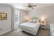 Bright bedroom features a ceiling fan, window with curtains, and queen sized bed at 814 Rutledge Ave, Charleston, SC 29403