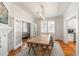 Bright and airy dining room with hardwood floors, modern chandelier, and access to the living room at 814 Rutledge Ave, Charleston, SC 29403