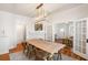 Elegant dining room featuring hardwood floors, chic lighting, and seamless access to the living area at 814 Rutledge Ave, Charleston, SC 29403
