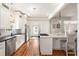 Modern kitchen featuring white cabinets, stainless steel appliances, and hardwood floors at 814 Rutledge Ave, Charleston, SC 29403